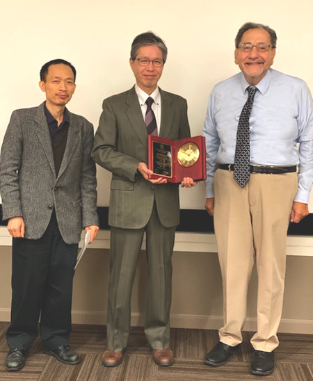Dr. Song Hong with Dr. Kobayashi and Dr. Bazan presenting the plaque