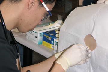 Science and Practice of Medicine 200: Clinical Skills Lab - 2nd Year Medical Student performing Lumbar Puncture