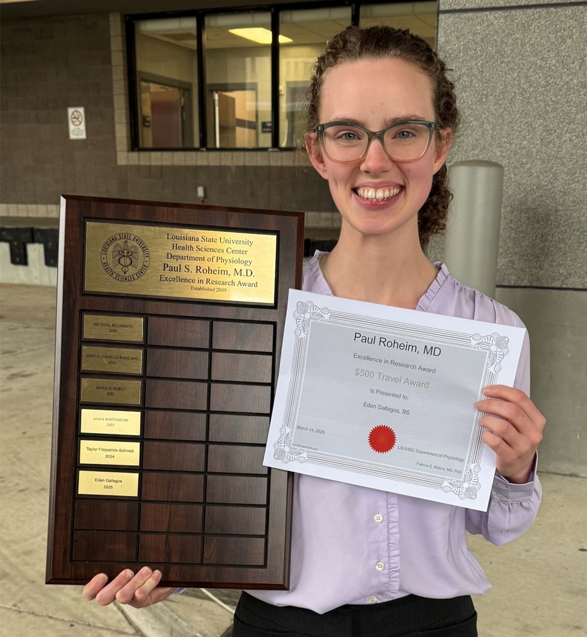 Eden Gallegos with award