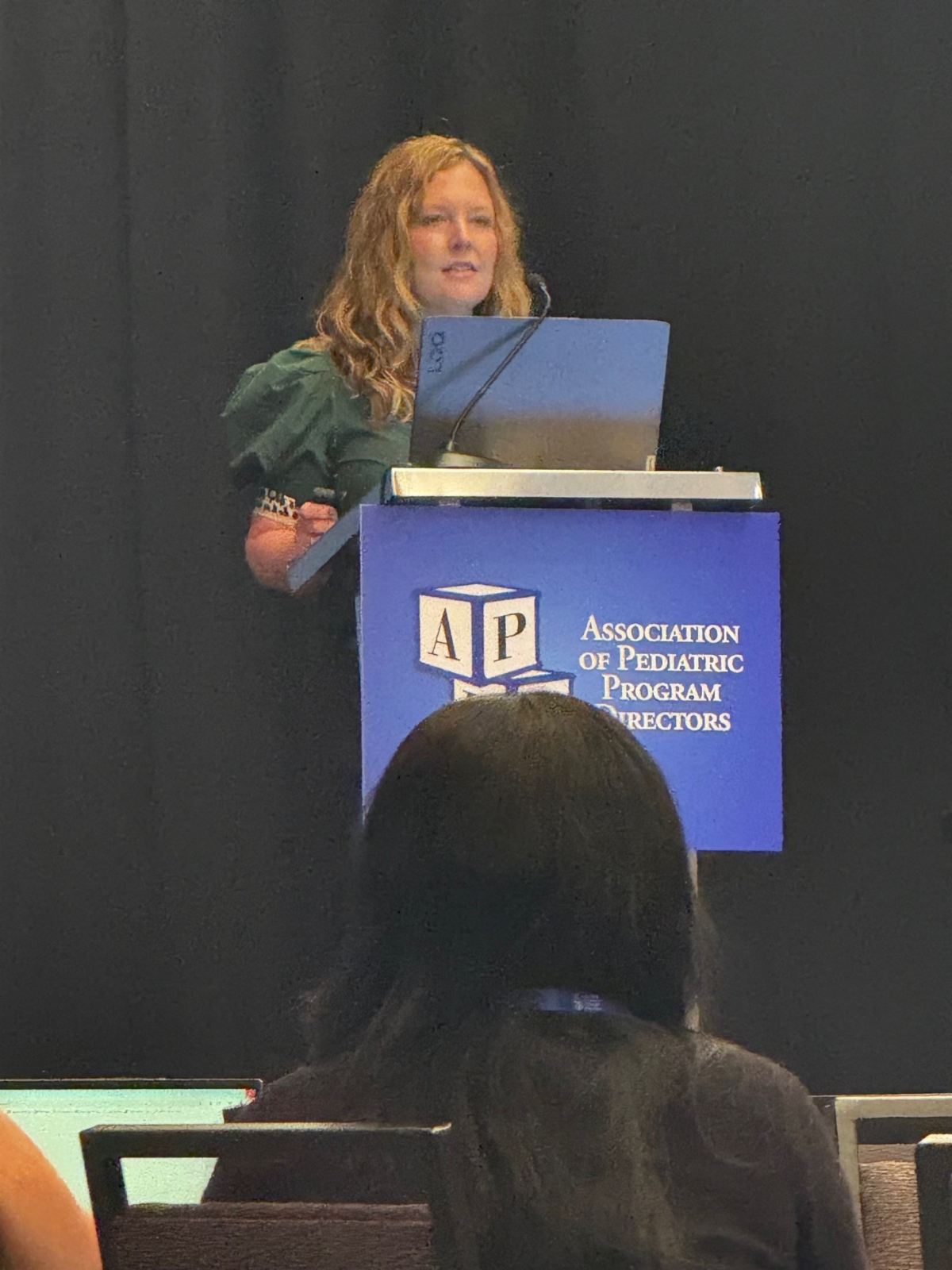 Dr. Sandlin at the podium