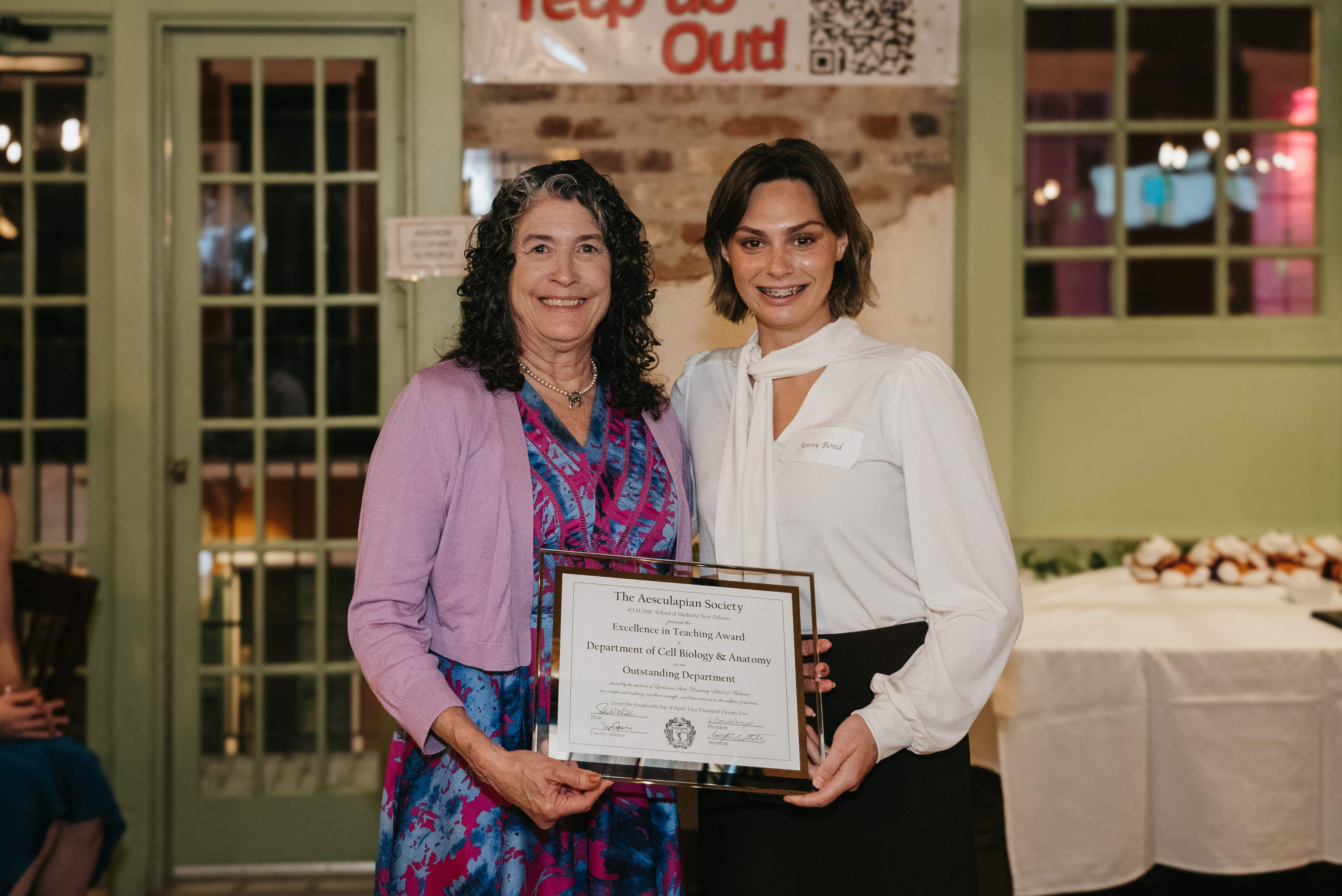 Dr. Canavier accepts award for department