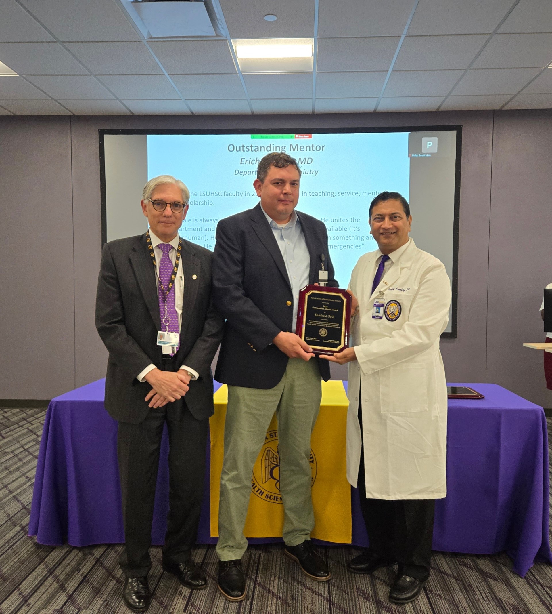 Dr. Conrad accepts award