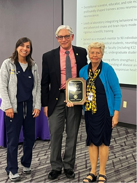 Dr. Belayev accepts award.
