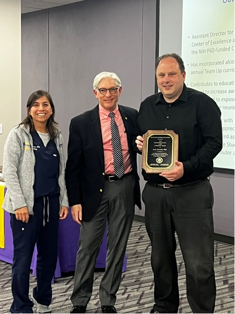 Dr. Edwards accepts award.