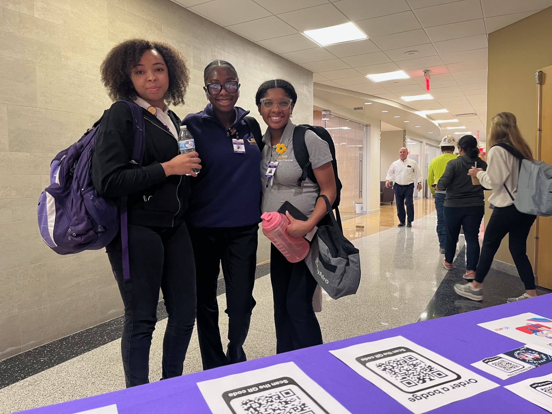 students stop at voter education table