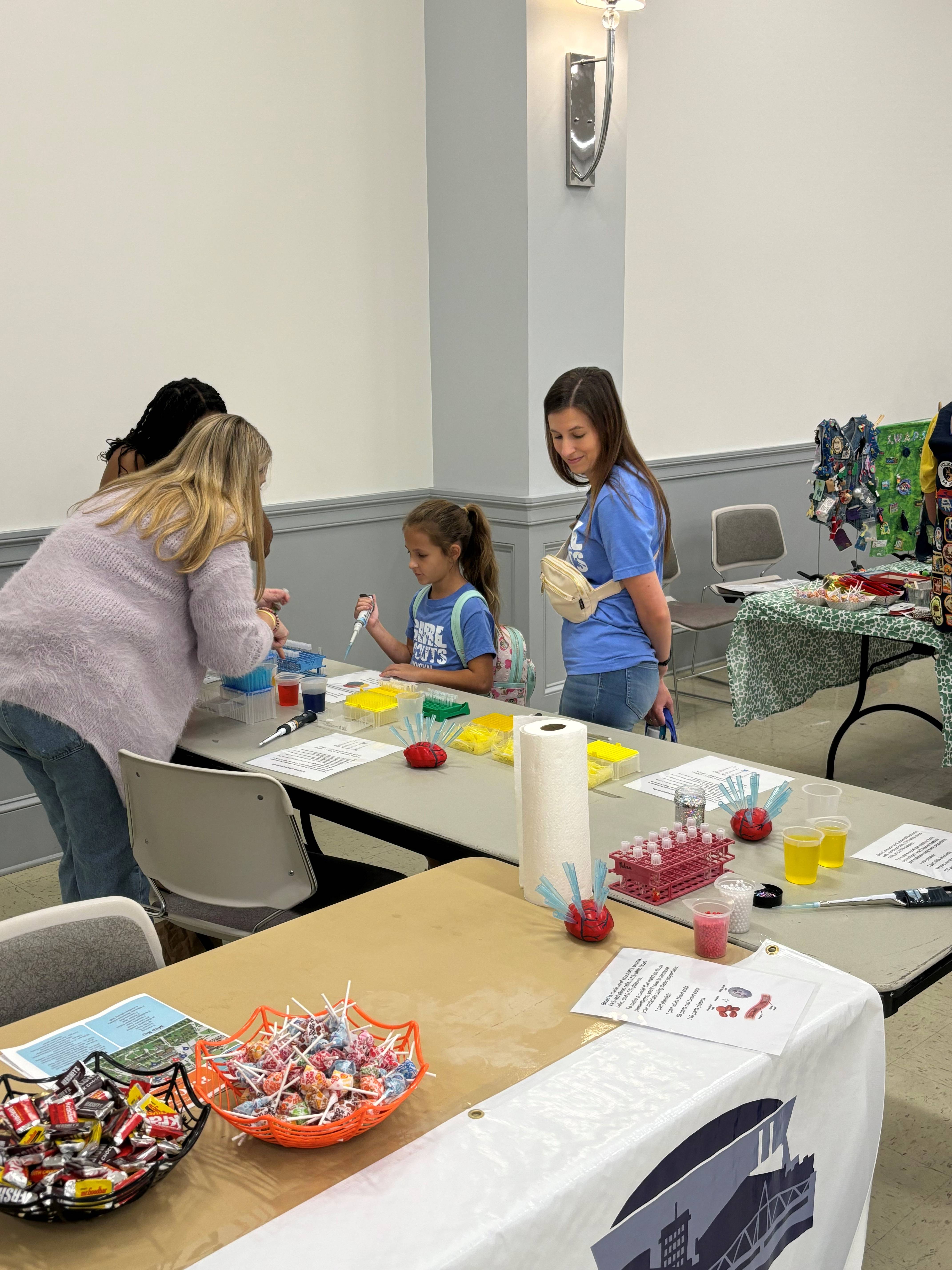 Girl Scout learns how to pipette