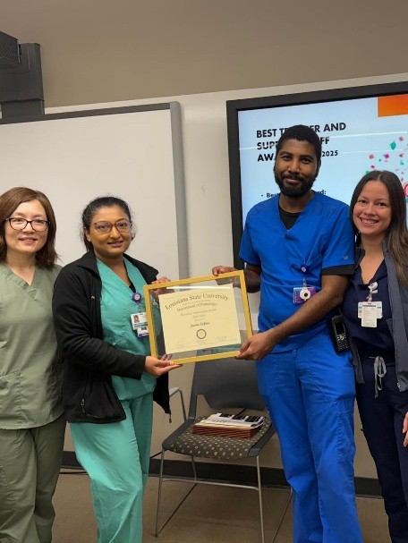 Dr. Lofton accepts award.