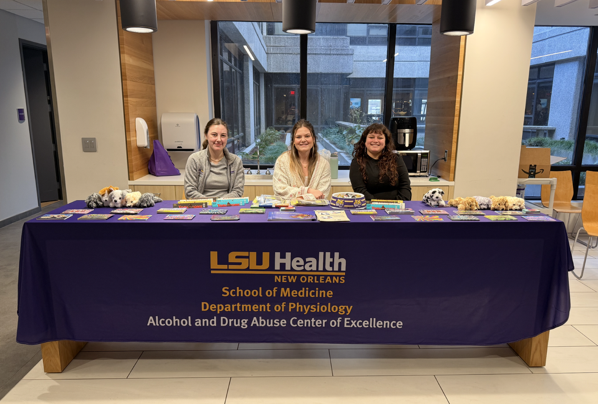 Volunteers man the table at Fitness Friday