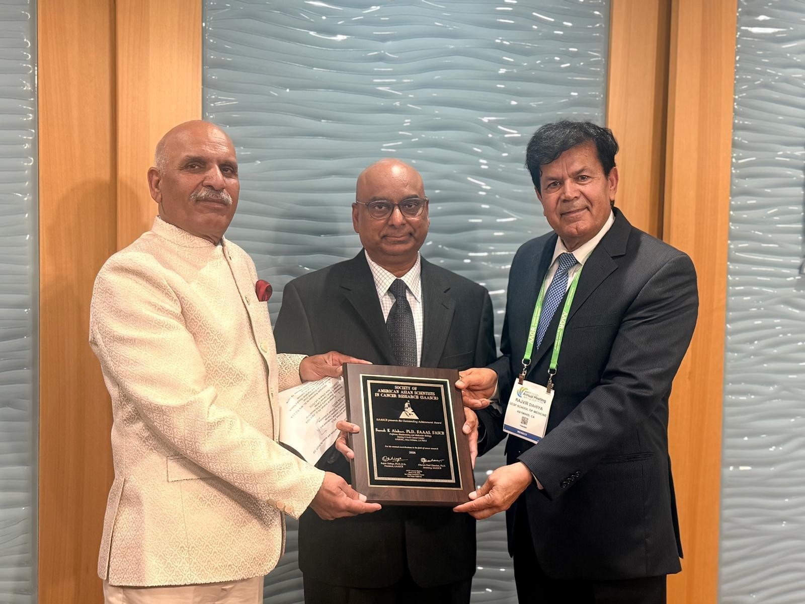 Dr. Alahari is shown receiving award for his exceptional research.