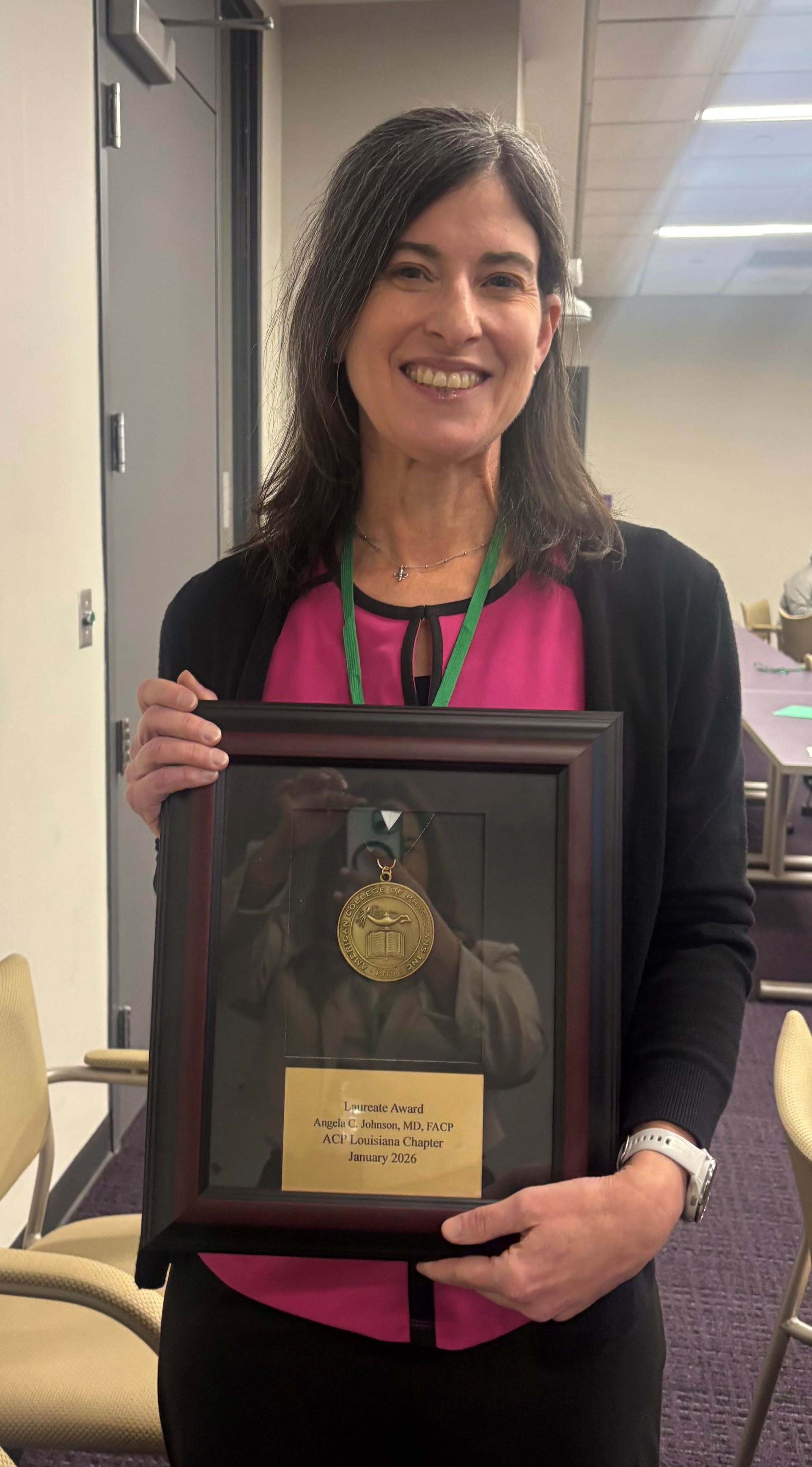 Dr. Johnson holds her ACP Chapter Laureate award.