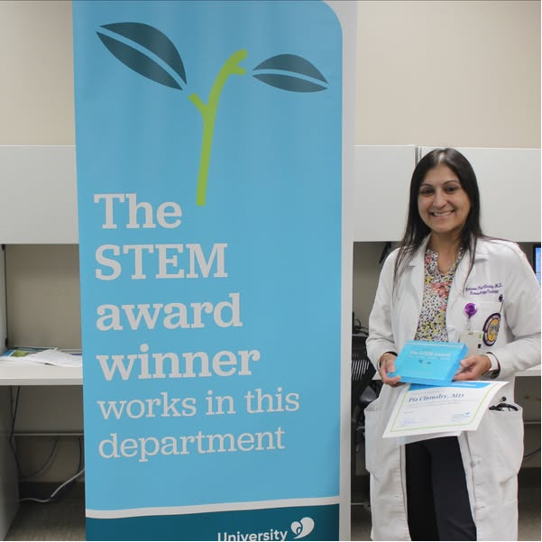 Dr. Chowdry accepts the STEM award.