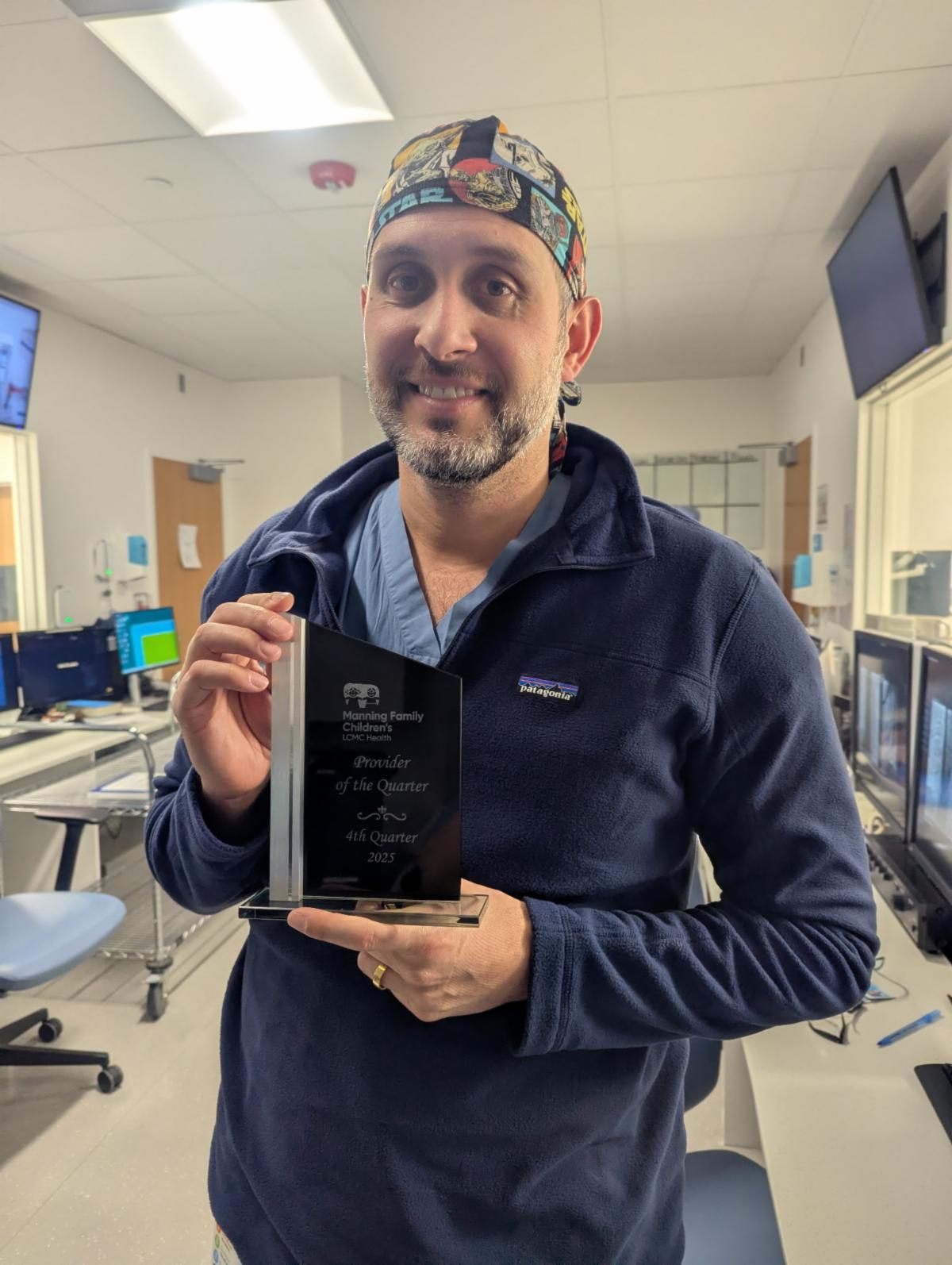 Dr. Mejia accepts his Provider of the Quarter award.