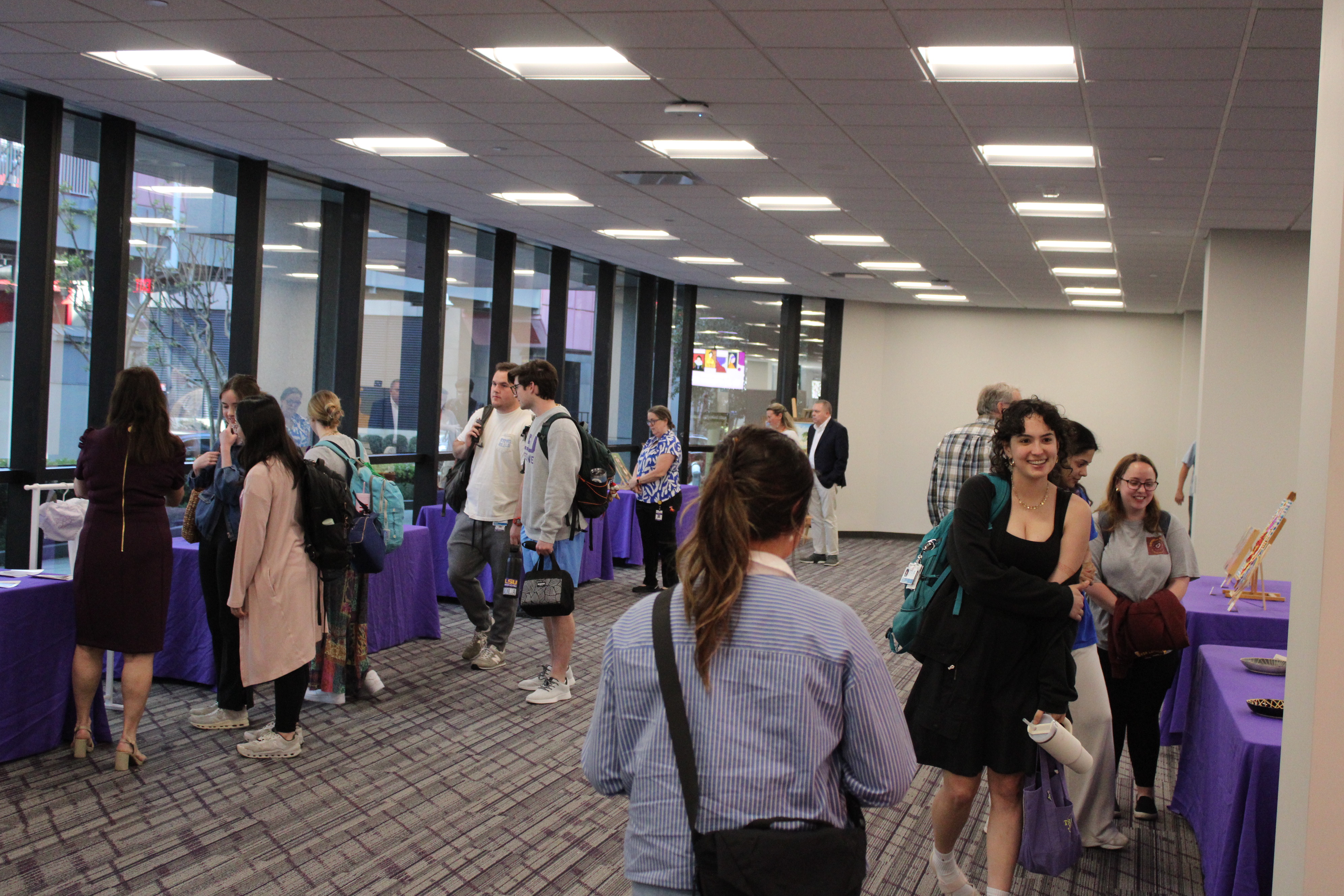 Art enthusiasts peruse exhibits