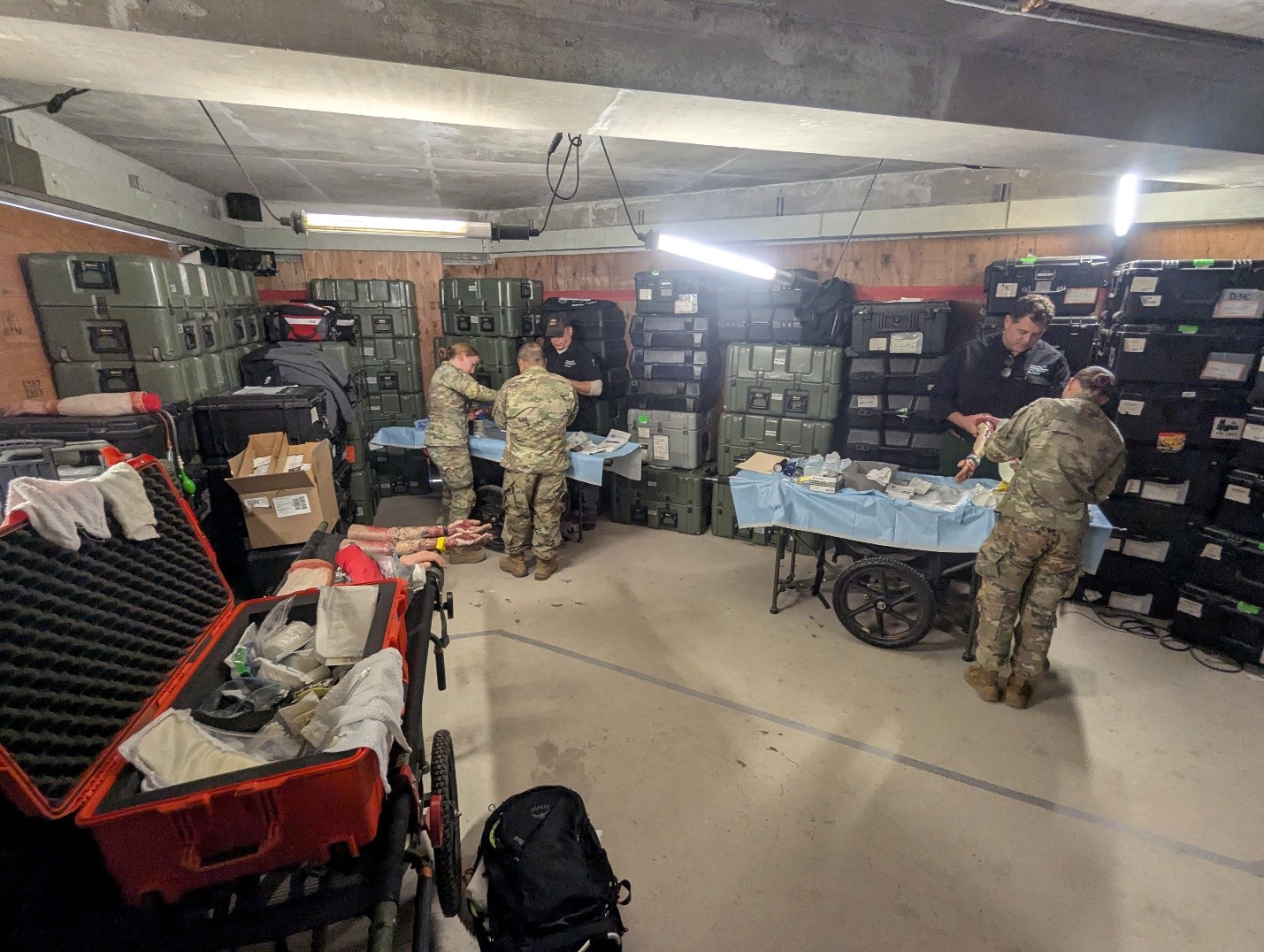 LTC (Ret.) Mario A. Rivera‑Barbosa (left) and Dr. Jeffrey Carter (right) evaluate hands‑on burn care skills demonstrated by volunteer military healthcare providers participating in the BP2 construct validity study. 