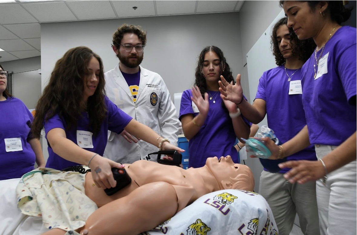 High school students learn basic medical procedures during Day With Docs
