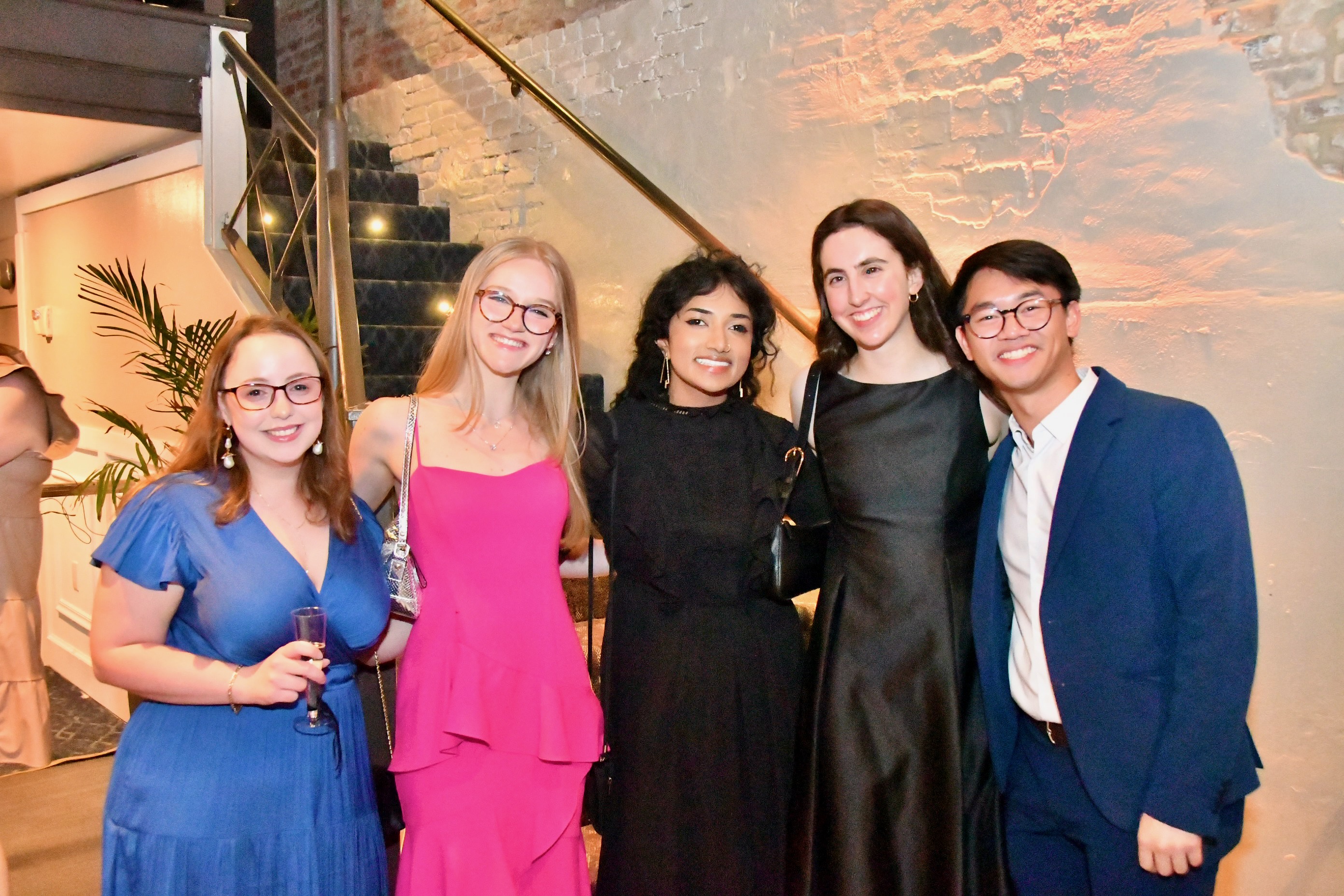 Attendees dressed in gala attire