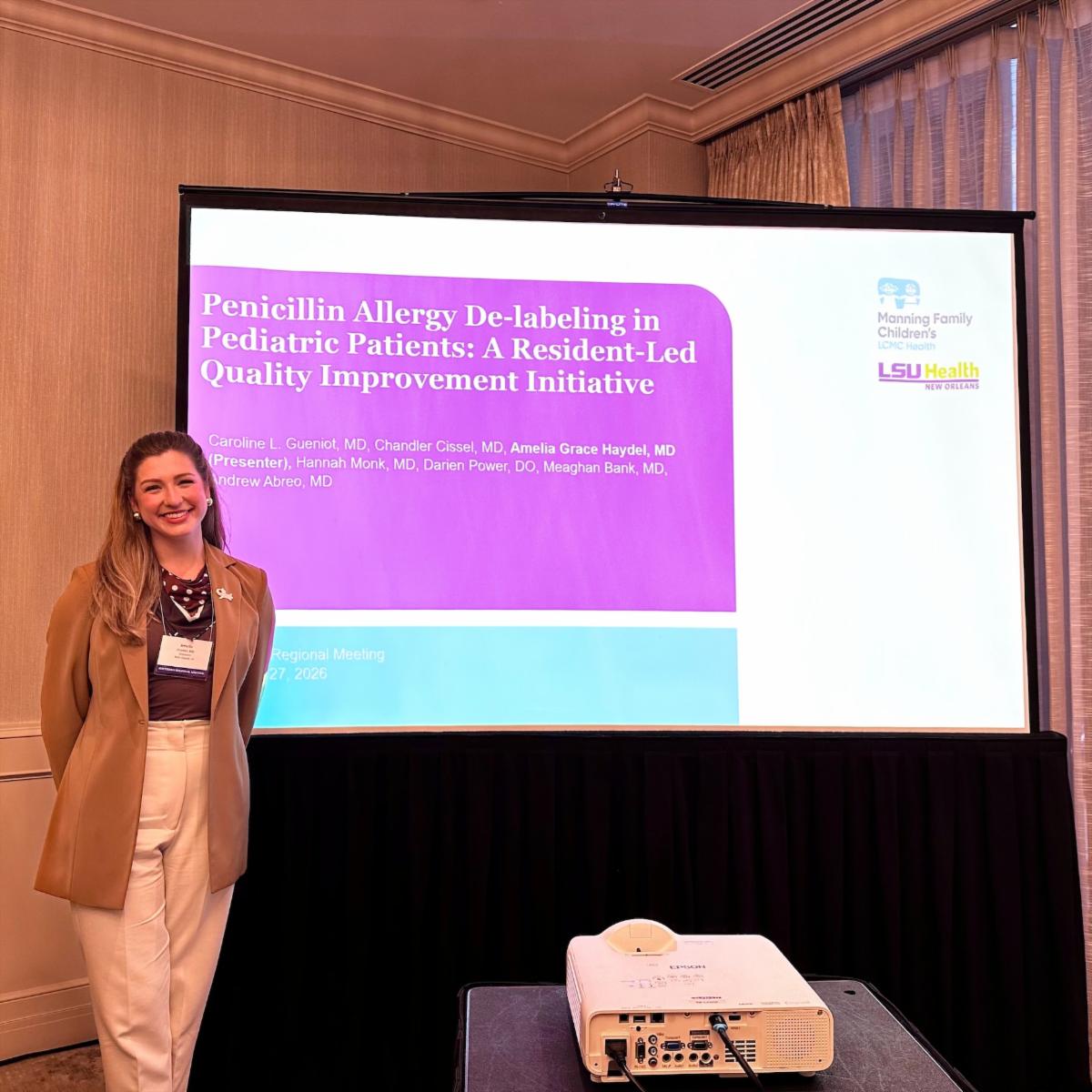 Dr. Amelia Haydel next to her presentation