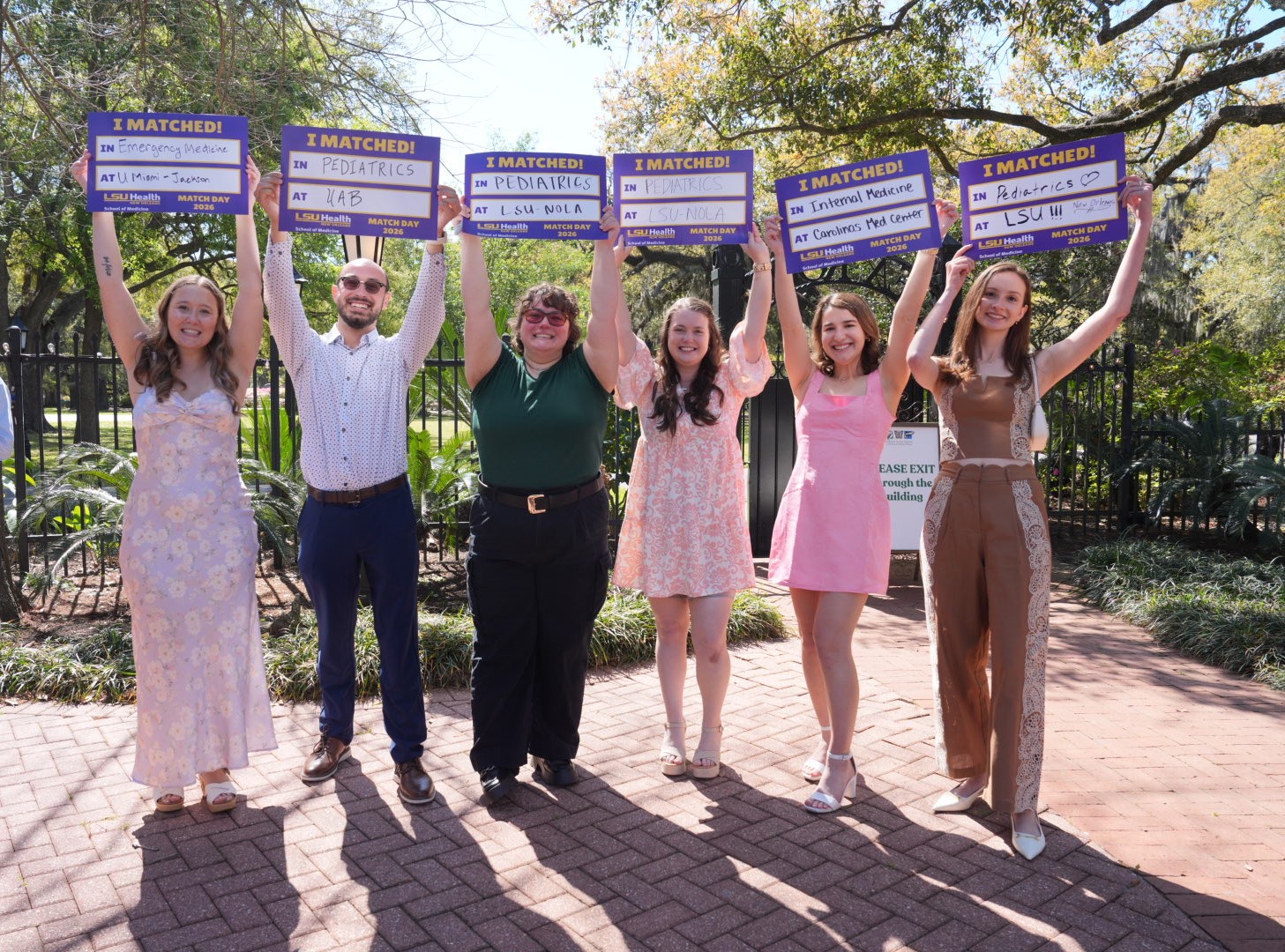 LSU Health New Orleans students celebrate their matches to residency programs by holding up signs showing where they are going.