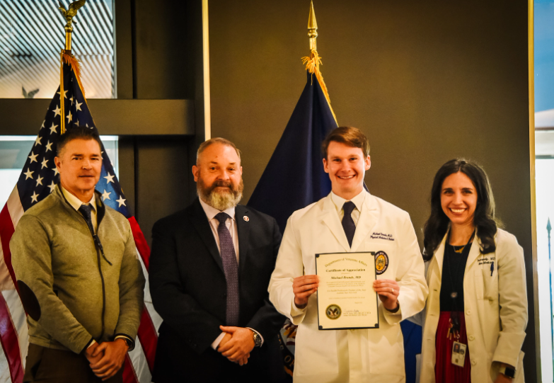Dr. Michael Brands is awarded Resident of the Year award.